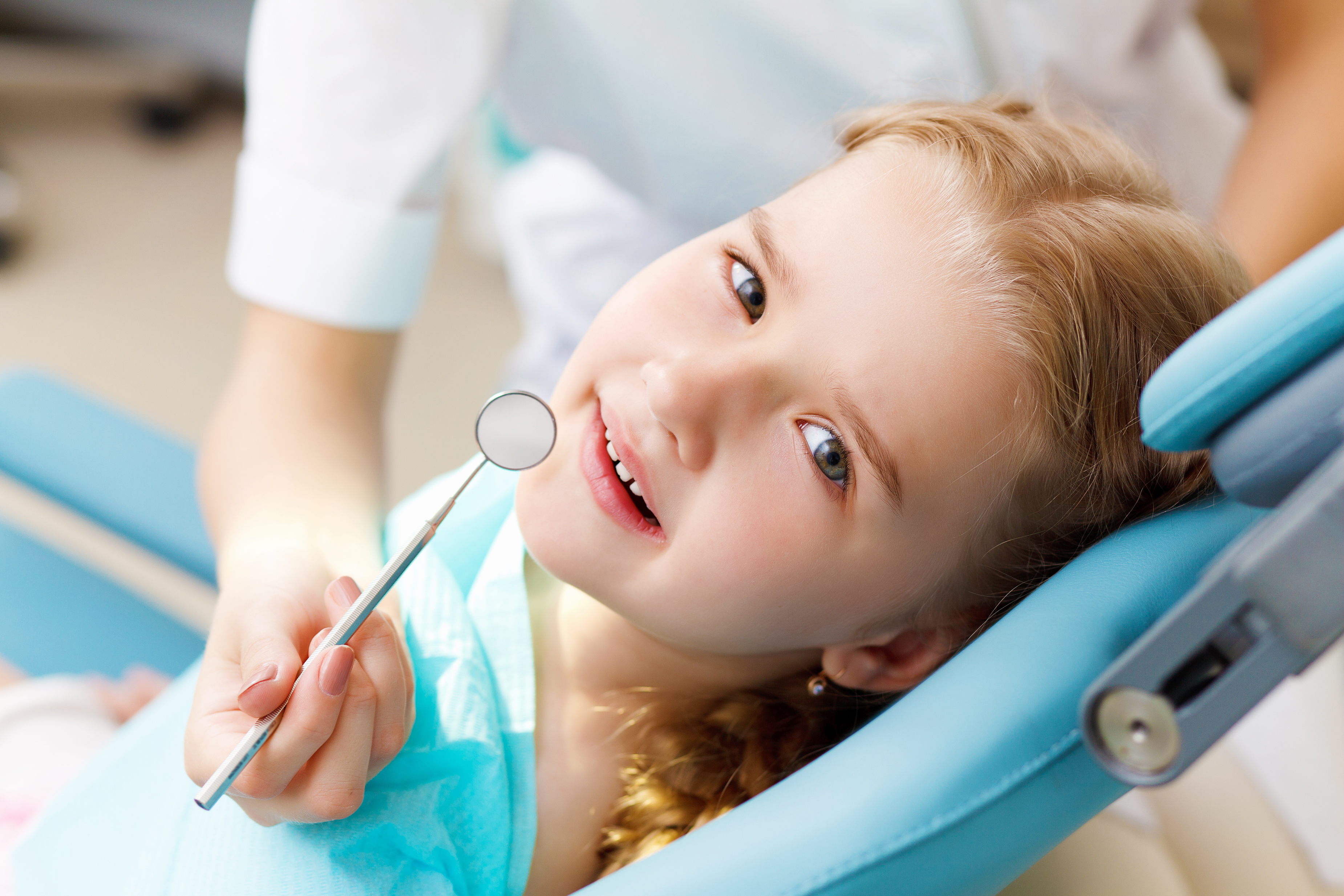 bigstock-little-girl-visiting-dentist-35934937.jpg